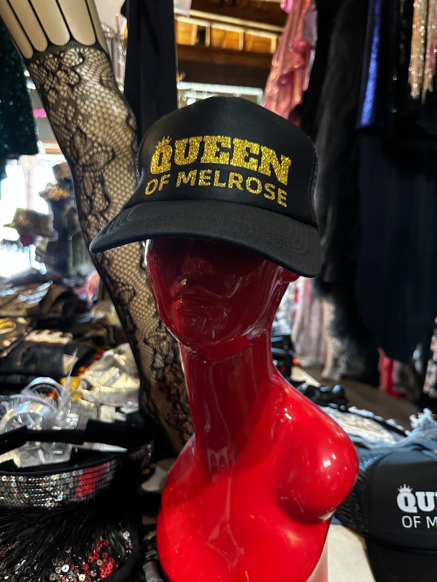 QUEEN OF MELROSE GOLD TRUCKER HAT